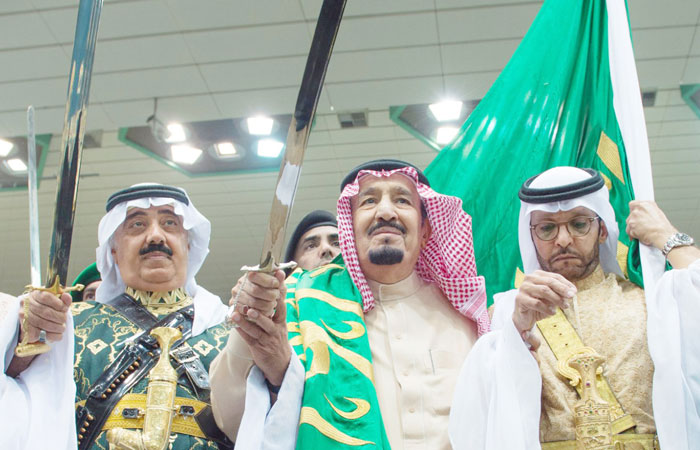 Custodian of the Two Holy Mosques King Salman performs the traditional Saudi 'Ardah' dance as part of the 31st Janadriya Festival this week. The King danced alongside others with swords and at one point took the Kingdom’s flag and kissed it in appreciation. — SPA