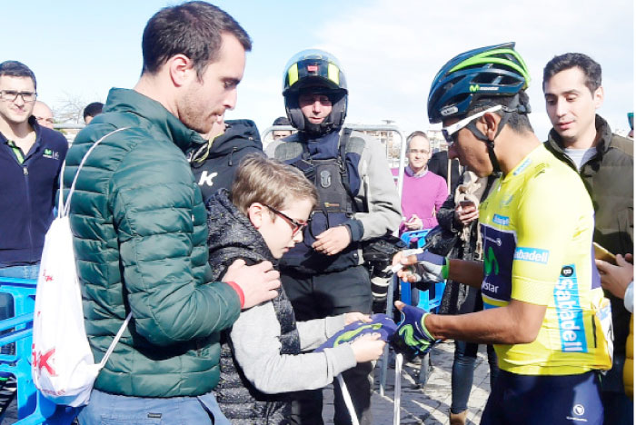 Movistar’s Colombian cyclist Nairo Quintana signs autographs before the satrt of the fifth stage of the 68th edition of “Volta Ciclista a la Comunidad Valenciana” (Tour of Valencian Community), a 130.2 km run between Paterna and Valencia on Sunday. — AFP