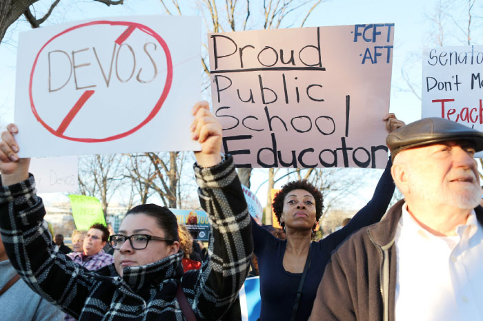 Protestors demonstrate against President Trump’s nominee for secretary of education, Betsy DeVos, on Capitol Hill on Sunday in Washington, DC. — AFP