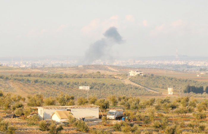Smoke rises after strikes on rebel-held Deraa city, Syria. — Reuters
