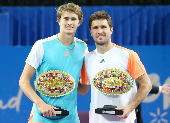 Germany’s Alexander Zverev (L) and Mischa Zverev pose with their trophies after winning the doubles final tennis match at the ATP World Tour Open Sud de France in Montpellier, southern France, on Sunday. — AFP