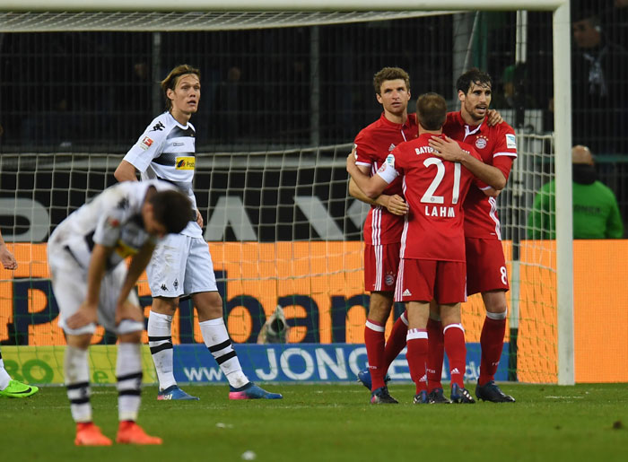 Bayern Munich´s players react after the Bundesliga football match against Borussia Moenchengladbach on Sunday. — AFP