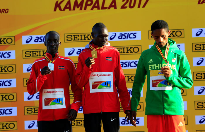 Gold medalist Kenya's Geoffrey Kipsang Kamworor (C), silver medalist Kenya's Leonard Kiplimo Barsoton (L) and bronze medalist Ethiopia's Jemal Yimer pose on the podium after the race in Kampala Sunday. — Reuters