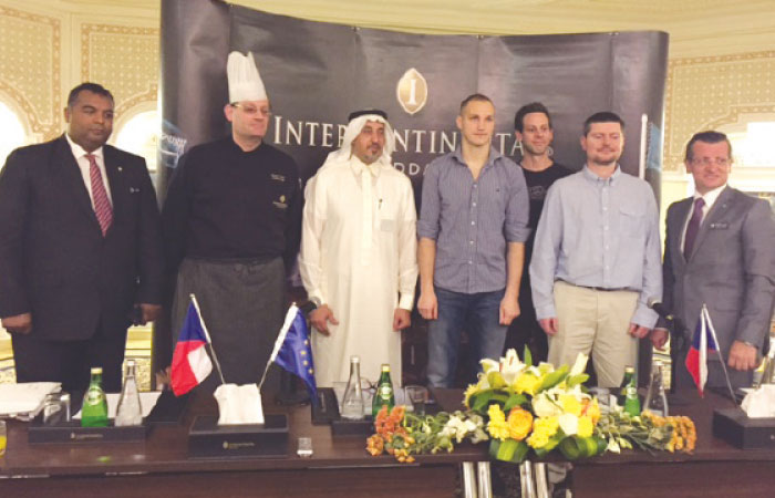 The Honorary Consul of the Czech Republic Hussein Shobokshi poses with director of food and beverage Baris Altinkok of InterContinental Hotel Jeddah, Czech chefs and other hotel staff.
