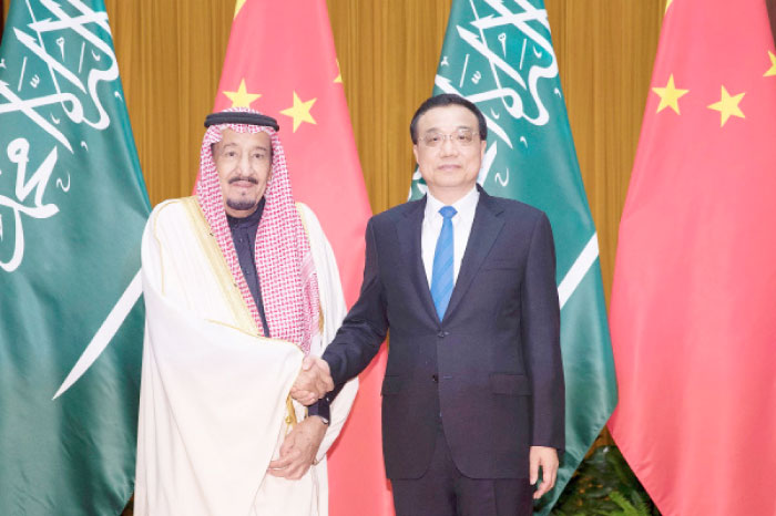Custodian of the Two Holy Mosques King Salman and Chinese Premier Li Keqiang at Great Hall of the People in Beijing, Friday. — AFP