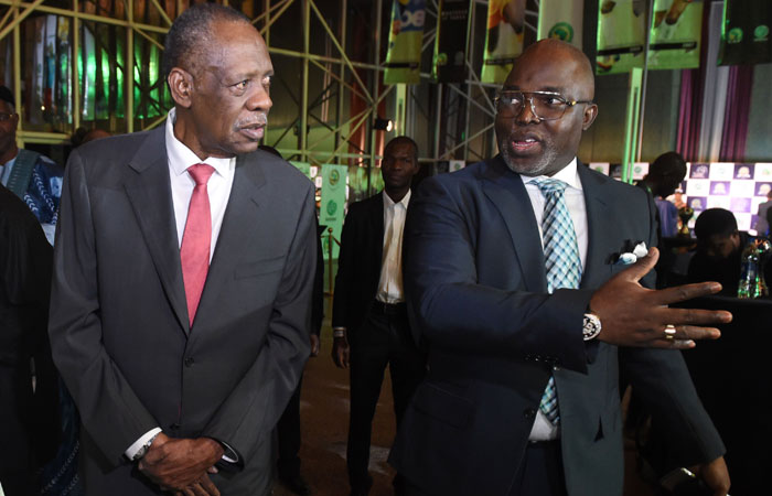 This file photo shows president of the Nigerian Football Federation Amaju Pinnick (R) speaking with incumbent president of the Confederation of African Football (CAF) Issa Hayatou (L) during the CAF African footballer of the year awards, in Abuja. — AFP
