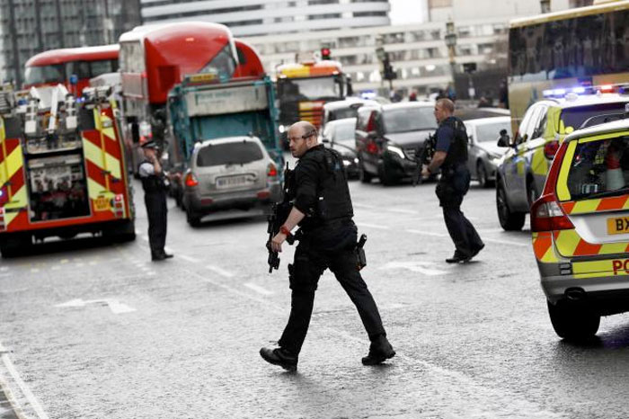 Armed police respond outside Parliament during an incident on Westminster Bridge in London, Britain. Reuters