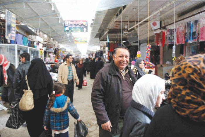 People do shopping at a market after returning to their homes in the city of Mosul, Iraq. — Reuters