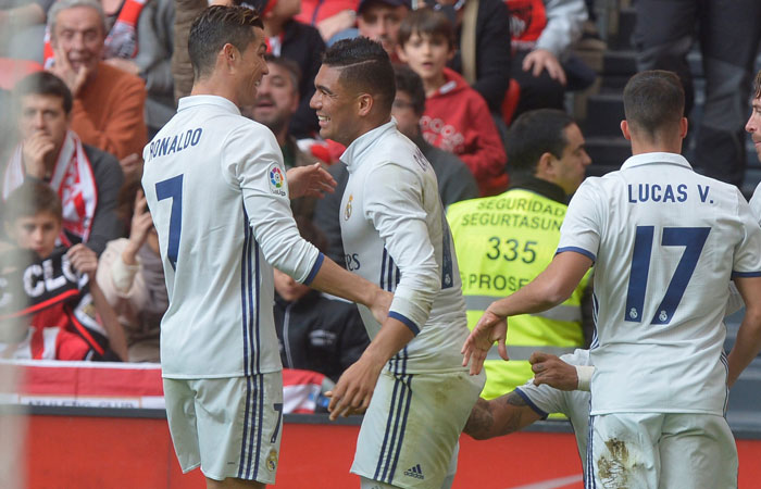 Real Madrid's Cristiano Ronaldo, Carlos Casemiro, Lucas Vazquez and Sergio Ramos celebrate goal by Carlos Casemiro against Athletic Bilbao during their Spanish league match at Bilbao Saturday. — Reuters