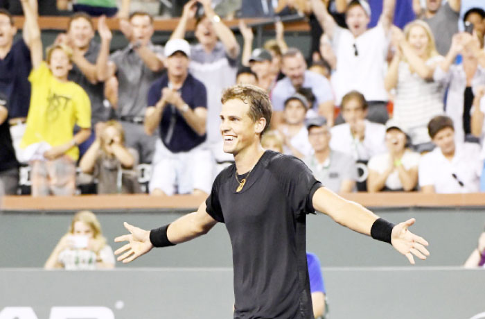 Vasek Pospisil of Canada celebrates after defeating Andy Murray of Great Britain at the BNP Paribas Open Tennis Tournament, in Indian Wells Saturday. — AP