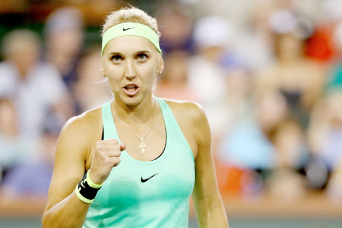 Elena Vesnina of Russia celebrates a point against Kristina Mladenovic of France during the semifinals of the BNP Paribas Open in Indian Wells Friday. — AFP