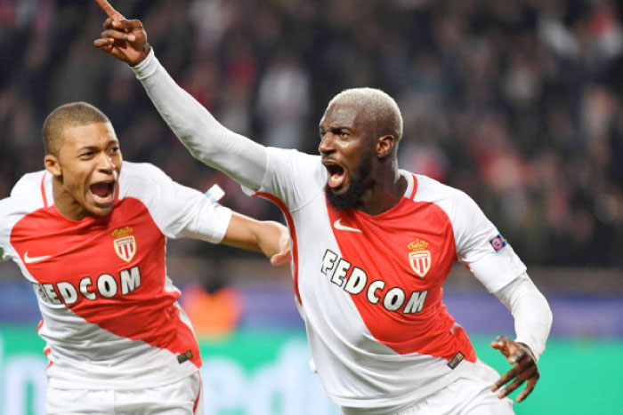 Monaco’s midfielder Tiemoue Bakayoko (R) celebrates with teammate Kylian Mbappe Lottin after scoring a goal against Manchester City during the UEFA Champions League match in Monaco Wednesday. — AFP