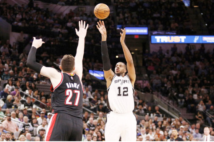 San Antonio Spurs’ power forward LaMarcus Aldridge shoots the ball over Portland Trail Blazers’ center Jusuf Nurkic during their NBA game at AT&T Center in San Antonio Wednesday. — Reuters