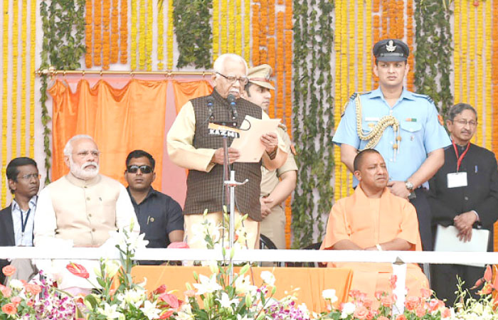 India’s Prime Minister Narendra Modi, second left, looks on as the governor of the northern Indian state of Uttar Pradesh Ram Naik, center, presides over the swearing-in ceremony of the new government of the state including the Chief Minister Yogi Adityanath, third right, in Lucknow on Sunday. — AFP