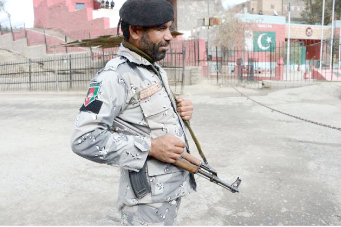 An Afghan border police personnel stands guard at the Torkham border crossing between Afghanistan and Pakistan in this Feb. 17, 2017 file photo. — AFP
