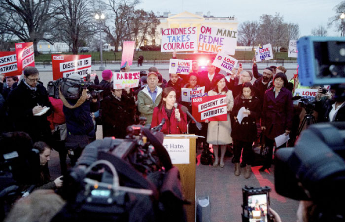 People gather for a protest against President Donald Trump’s new travel ban order in Lafayette Park outside the White House, Monday, March 6 in Washington. — AP