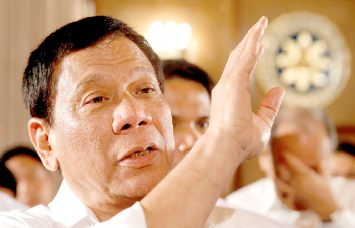 Philippine President Rodrigo Duterte talks to reporters after a news conference at the presidential palace in Manila on Monday. — Reuters