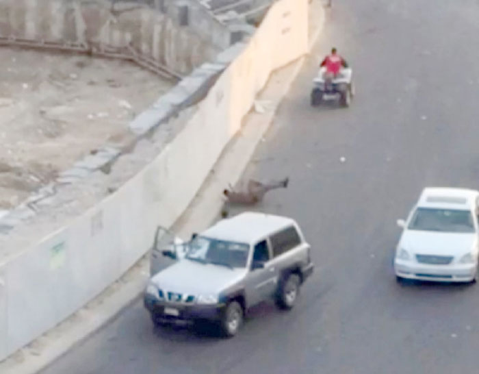 A video clip posted on social media shows one of the attackers fleeing on a quad bike after hitting a policeman lying on the ground.