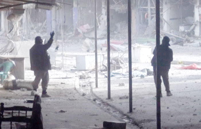 Men purported to be Daesh fighters are pictured during a battle in what is said to be southwestern Mosul, Iraq, in this still image taken from an undated video. — Reuters