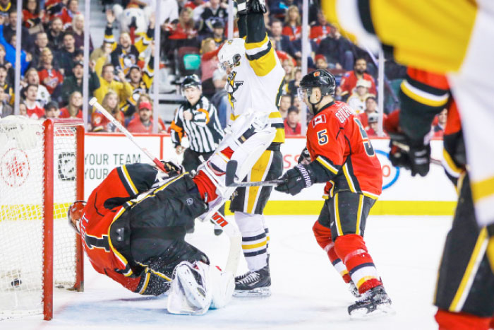 Calgary Flames goalie Brian Elliott (1) reacts as Pittsburgh Penguins center Sidney Crosby (87) scores a goal during the third period at Scotiabank Saddledome. Calgary Flames won 4-3. — Reuters