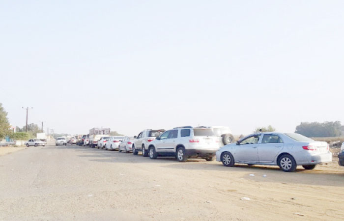 Kilometer-long lines are seen outside the Motor Vehicle Periodic Inspection center in Jazan as the authorities have started strictly enforcing the vehicle testing rules. — Okaz photo