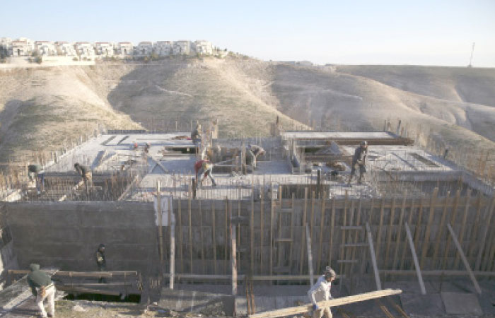 This Feb. 7, 2017, file photo shows Palestinian laborers work at a construction site in a new housing project in the Israeli settlement of Maale Adumim, near occupied Jerusalem. Israel’s defense minister says the US has notified Israel that imposing Israeli sovereignty over the West Bank would lead to an “immediate crisis” with the Trump administration. — AP