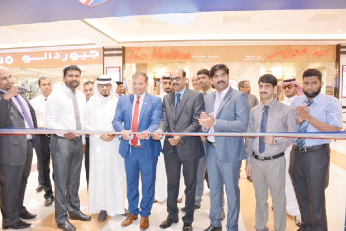 British Consul General Barrie Peach cuts the ceremonial ribbon during the inaugural of the British Food Festival at LuLu Hypermarket, Jeddah. In the group photo with him are Hasees, regional manager;  Rills Musthafa, general manager;  Shameer, purchasing manager; Shabeer, internal auditor; Iqbal, commercial executive, among others.