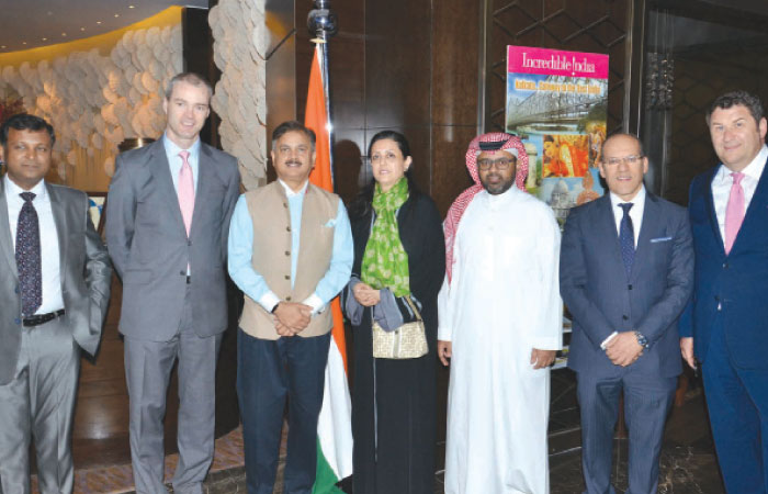 Group photo of Four Seasons Hotel Riyadh executives with Indian Ambassador Ahmad Javed during the opening event