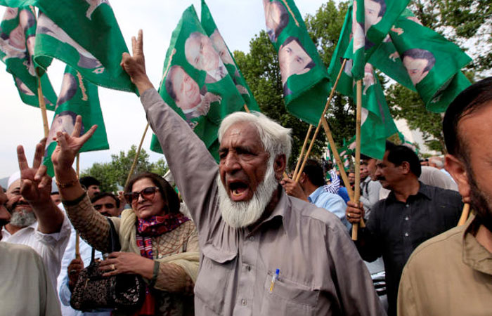 Supporters of Pakistan's Prime Minister Nawaz Sharif gesture following the Supreme Court decision, in Islamabad, Pakistan. — Reuters