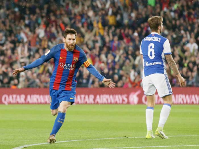 Barcelona’s Lionel Messi celebrates a goal against Real Sociedad in their Spanish La Liga match in Barcelona Saturday. — Reuters