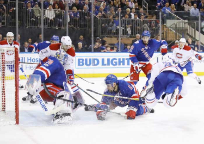 Henrik Lundqvist (No. 30) and Dan Girardi (No. 5) of the New York Rangers defend against the Montreal Canadiens in Game Four of the Eastern Conference Stanley Cup playoffs at Madison Square Garden in New York Tuesday. — AFP