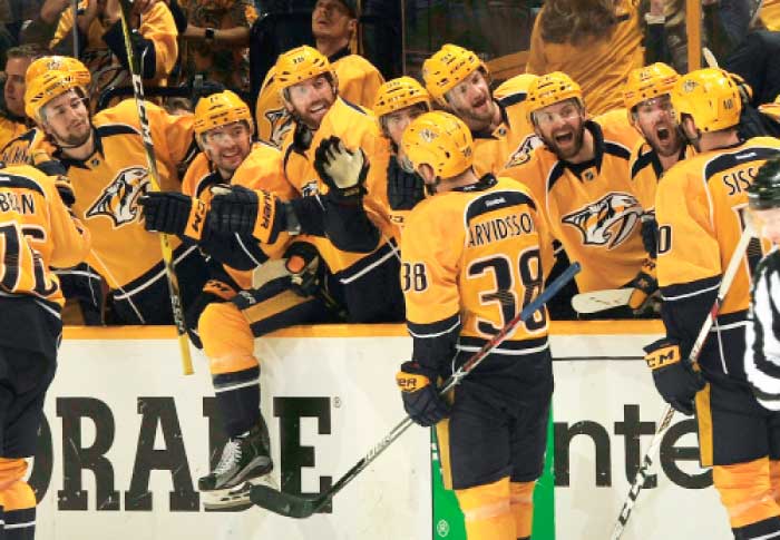 Nashville Predators’ players celebrate after defeating Chicago Blackhawks in Game 4 of the NHL playoff series in Nashville Thursday. — Reuters