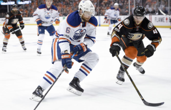 Edmonton Oilers’ defenseman Adam Larsson (L) moves the puck defended by Anaheim Ducks’ defenseman Cam Fowler during their NHL Playoffs at Honda Center at Anaheim Wednesday. — Reuters