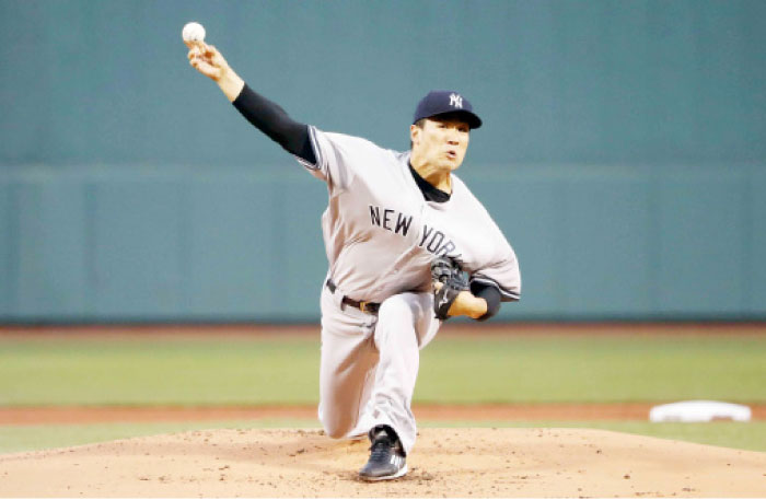 The New York Yankees’ starting pitcher Masahiro Tanaka delivers against the Boston Red Sox during their MLB game at Fenway Park in Boston Thursday. — Reuters