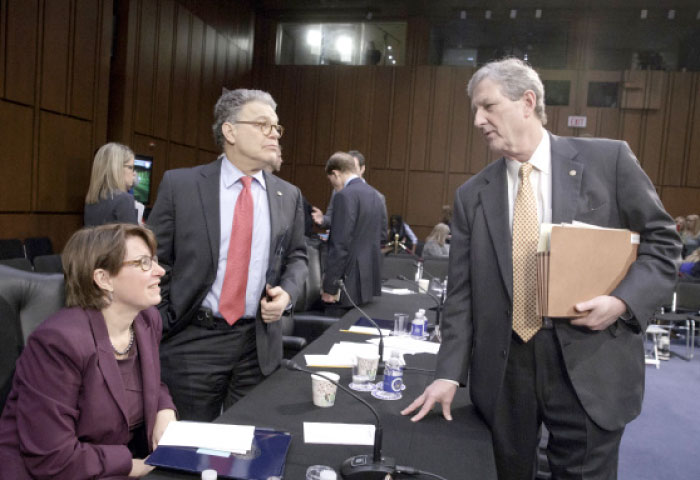 Senate Judiciary Committee, from left, Sen. Amy Klobuchar, D-Minn., and Sen. Al Franken, D-Minn., Sen. John Kennedy, R-La., confer on Capitol Hill in Washington, Monday, April 3, 2017, after the GOP-led panel advanced the nomination of President Donald Trump’s Supreme Court nominee Neil Gorsuch. — AP