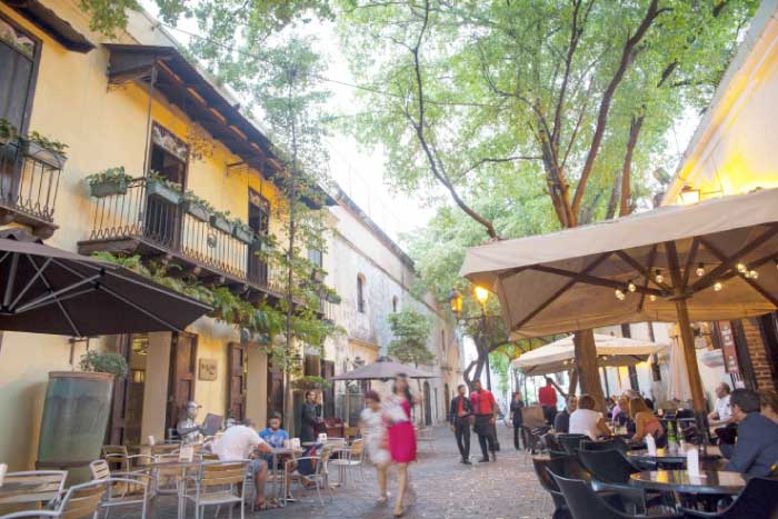 People walk on El Conde street in the Colonial Zone of Santo Domingo, Dominican Republic. — AP