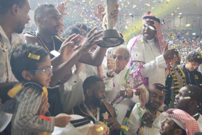Ittihad celebrates with the Saudi Basketball Federation Championship Trophy.