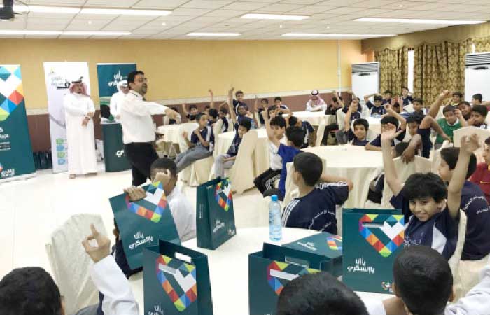 Nahdi officials talk to students during the diabetes awareness drive at  Prince Ahmed School. — Courtesy photo