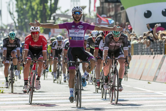 Colombia's Fernando Gaviria celebrates as he crosses the finish line to win the 13th stage of Giro d'Italia, Tour of Italy cycling race, from Reggio Emilia to Tortona, Friday. — AP 
