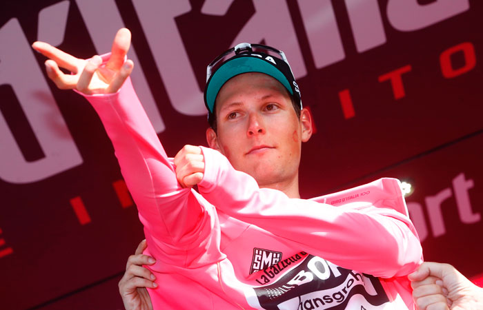 Austria's Lukas Postlberger of team Bora celebrates the Pink Jersey on the podium after winning the first stage of the 100th Giro d'Italia, Tour of Italy, from Alghero to Olbia in Sardinia Friday. — AFP