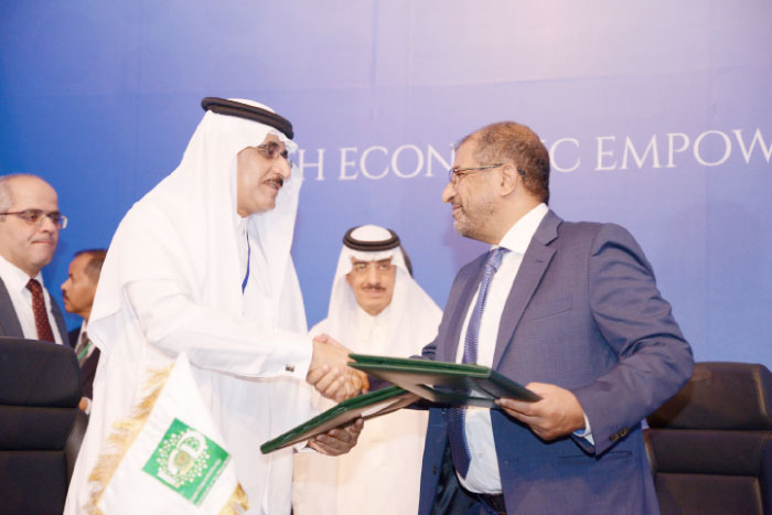 ICD CEO Khaled Al-Aboodi, Mohammed Al-Ammari, chairman of SIB and Yousef Al-Kuraimi, CEO and vice chairman of KIMB, signed the deal on behalf of their institutions In Jeddah. Also seen is IDB President Dr. Bandar M.H. Hajjar, center. — Courtesy photo