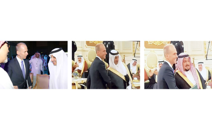A combo of pictures shows Boeing Chairman of the Board, President and CEO Dennis A. Muilenburg (in dark suit) with the top executives of some Saudi signatory companies