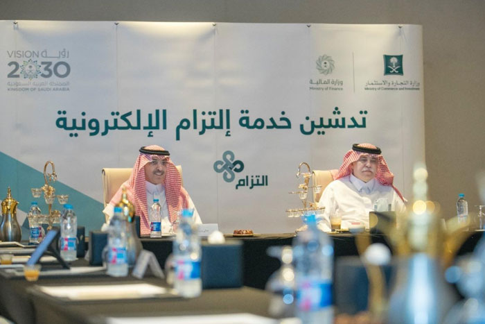 Minister of Commerce and Investment Majed Al-Qasabi and Minister of Finance Muhammad Al-Jadaan launching the ‘Eltzam’ electronic service in a ceremony held in Jeddah on Monday. – SPA