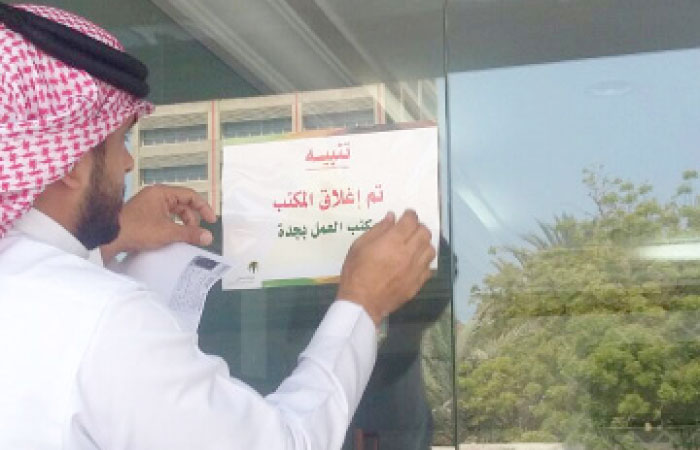 A labor inspector seals a recruitment office in Jeddah for violation of regulations. — Courtesy photo