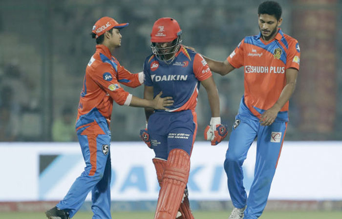 Gujarat Lions' Basil Thampi, right, and Ishan Kishan, left, pats Delhi Daredevils' Rishab Pant, center, after he was dismissed at 97 runs during their Indian Premier League (IPL) cricket match in New Delhi. — AP