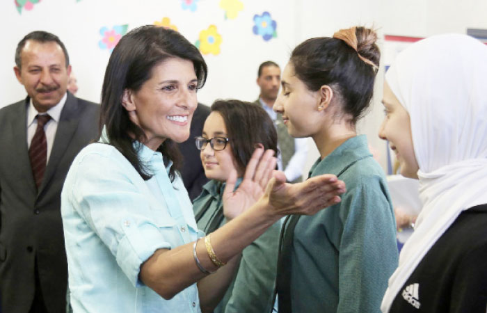 US Ambassador to the UN Nikki Haley (L) meeting with Syrian refugee students in the Jordanian capital Amman.  — AFP