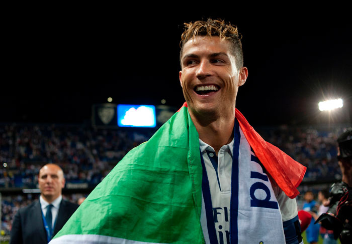 Real Madrid's Portuguese forward Cristiano Ronaldo smiles as he celebrates at the end of the Spanish league football match against Malaga at La Rosaleda stadium in Malaga on Sunday. — AFP
