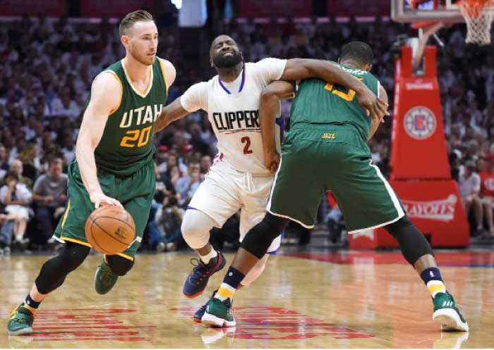 Utah Jazz forward Derrick Favors (15) sets a screen on Los Angeles Clippers guard Raymond Felton (2) as Utah Jazz forward Gordon Hayward (20) drives to the basket in the second period of game seven of the first round of the 2017 NBA Playoffs at Staples Center. — Reuters