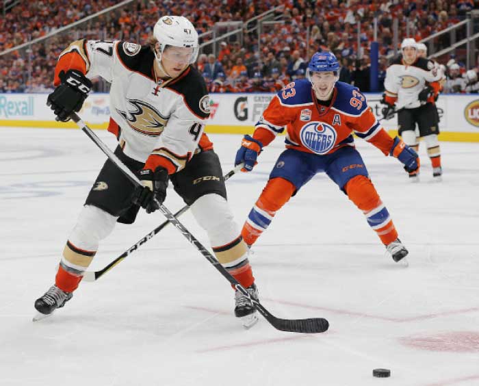 Anaheim Ducks defensemen Cam Fowler (4) clears the puck in front of Edmonton Oilers forward Ryan Nugent-Hopkins (93) during the third period in game three of the second round of the 2017 Stanley Cup Playoffs at Rogers Place. — Reuters