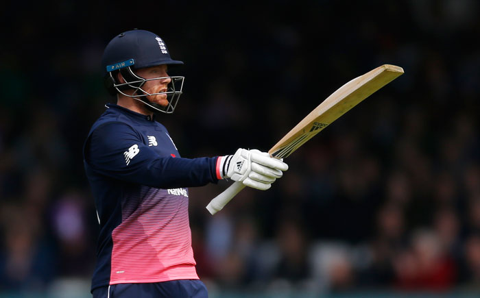 England's Jonny Bairstow celebrates scoring a half century. — Reuters